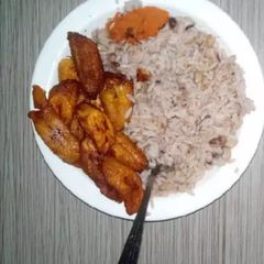 A picture of Rice and beans with plantain.