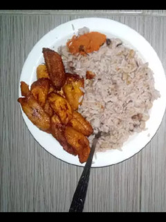 A picture of Rice and beans with plantain.