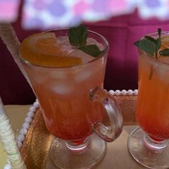 A picture of Red orange lime soda.