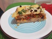 Una foto de pastel de choclo con queso