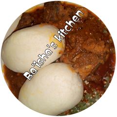 A picture of Moulded cous-cous with okro soup.
