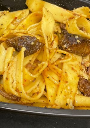 A picture of Crockpot stew meat over egg noodles.