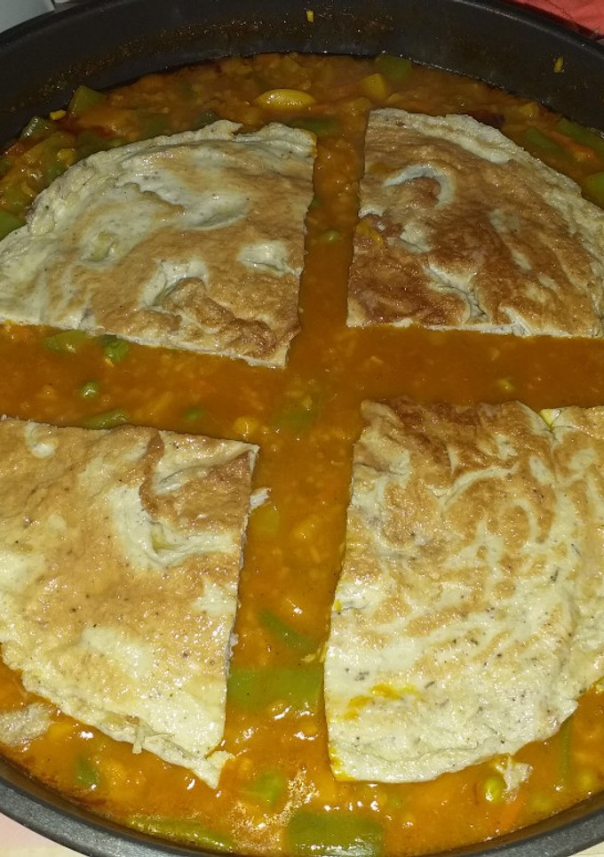 Una foto de Paella de verduras y tortilla