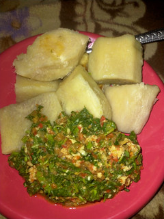 A picture of Boiled yam with vegetable sauce.