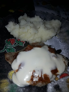 Una foto de Milanesa Napo con Puré