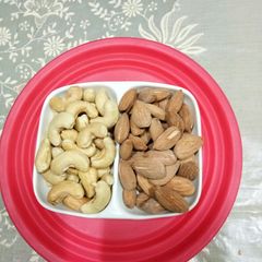 A picture of Salted Cashew nuts and Almonds.