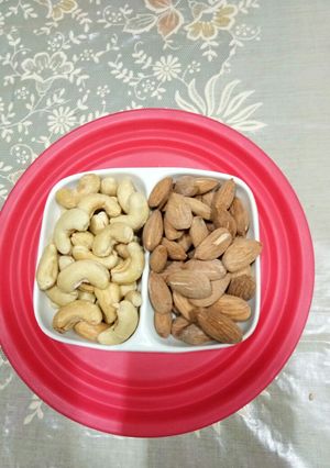 A picture of Salted Cashew nuts and Almonds.