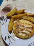 Provoleta asada con papas bravas