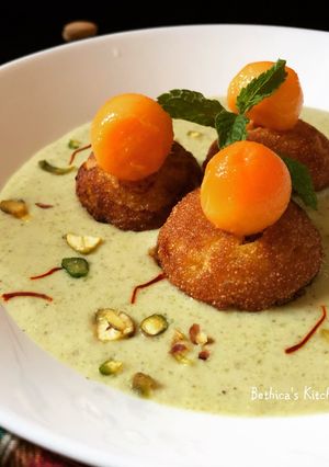 A picture of Mango Paniyaram in Kesar Pista Firni.