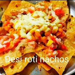 A picture of Desi roti nachos with spicy cheesy bean salsa.