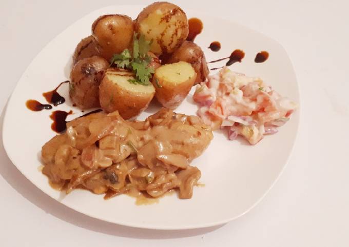 Jacket potatoes served with chicken in creamy soup