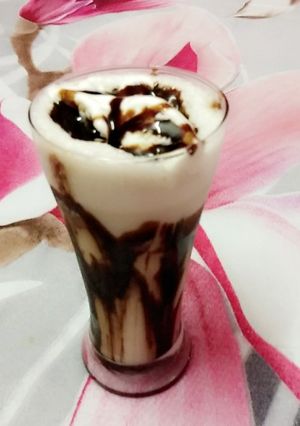A picture of Chocolate shake with vanilla Ice-cream.