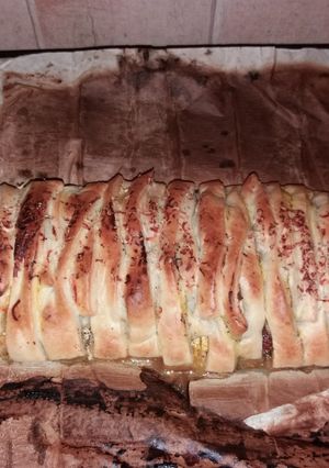 Une photo de Tresse feuilletée mozzarella tomate poule et champignons