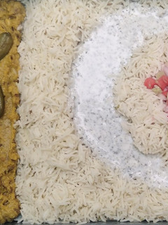 A picture of Daal Chawal with Salad and Chutney.