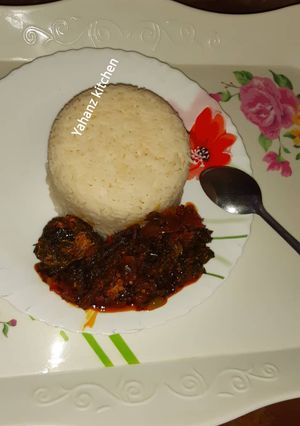 A picture of Vegetable soup with rice.