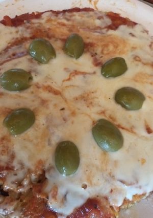 Una foto de Pizza de arroz y arvejas (sobras)