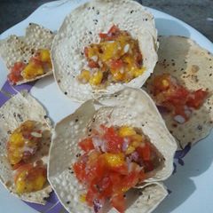 A picture of Mango salsa in papad basket #summer flavours #savoury.