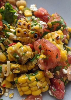 A picture of Brighten-up-your-day Mexican corn + tomato salad.