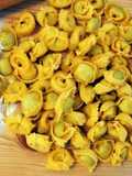 Tortellini di carne saltati con parmigiano e salvia
