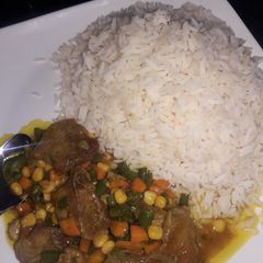 A picture of White rice and curry sauce.