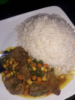 A picture of White rice and curry sauce.