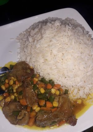 A picture of White rice and curry sauce.