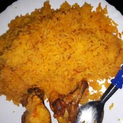 A picture of Tumeric rice served with grilled chicken.