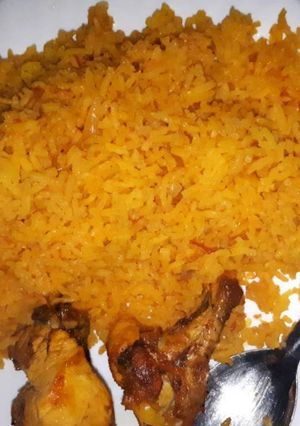 A picture of Tumeric rice served with grilled chicken.