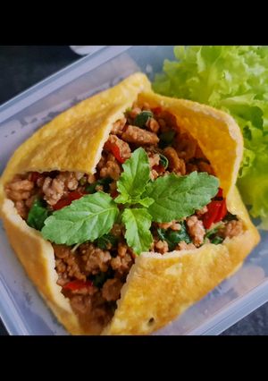 A picture of Thai Basil Pork Fried Rice Wrapped in Omelet (Kid-Friendly).