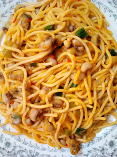 A picture of Jollof spaghetti and beans.