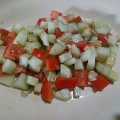 A picture of Tomato and cucumber salsa.