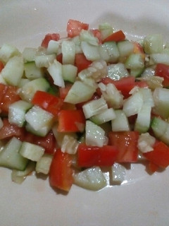 A picture of Tomato and cucumber salsa.