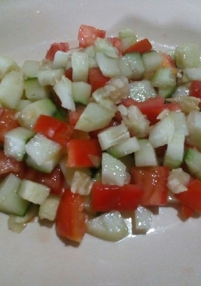 A picture of Tomato and cucumber salsa.