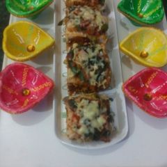 A picture of Cheesy Spring onion pav bites.