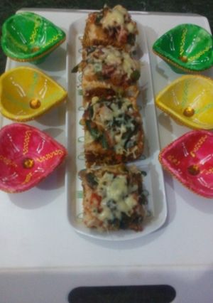 A picture of Cheesy Spring onion pav bites.