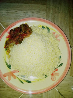 A picture of Couscous and meat sauce.