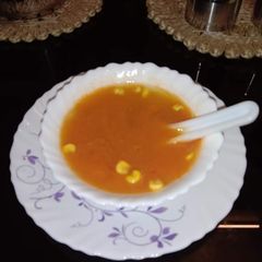 A picture of Carrot, corn soup.