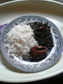 A picture of White rice with vegetable source.