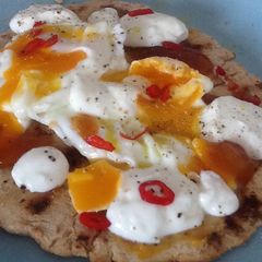 A picture of Flatbread with egg and mango chutney.