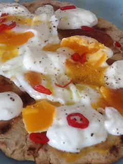 A picture of Flatbread with egg and mango chutney.