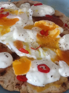 A picture of Flatbread with egg and mango chutney.