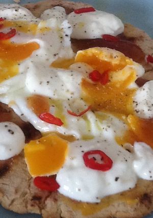 A picture of Flatbread with egg and mango chutney.