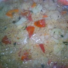 A picture of Noodles with veggies.