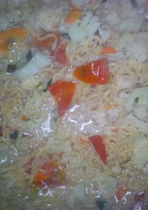 A picture of Noodles with veggies.