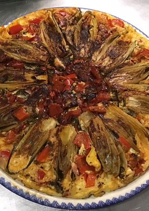Une photo de Flan d'endives caramélisées aux tomates, poivron, jambon cru et fromage frais