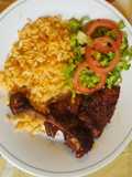 Pierna y muslo de pollo enchilado