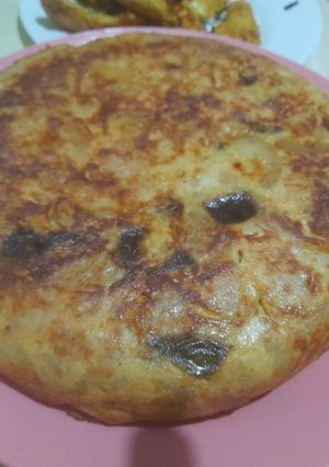 Una foto de Tortilla de calabacín y cebolla