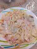 Fetuccini en salsa de champiñones, jamón y pecanas