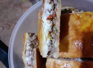 Una foto de Torta de carne picada puerro salsa blanca
