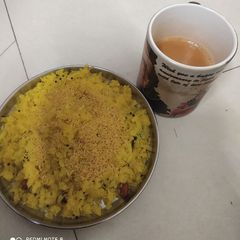 Poha with tea A picture of Poha with tea.